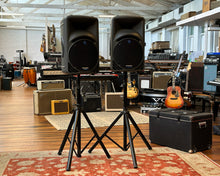 Load image into Gallery viewer, Mackie SRM450 Powered Speakers - Pair w/ Flight Cases &amp; Stands
